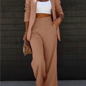 Women’s solid color blazer and pants set.